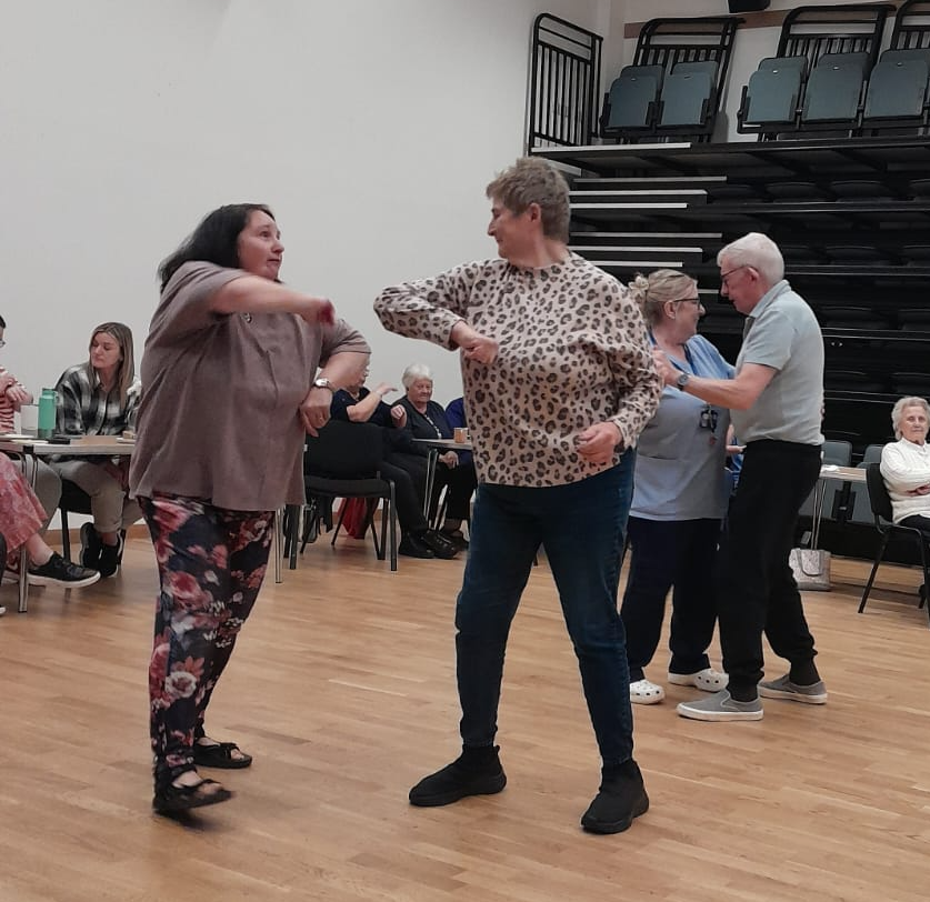 Members dance at boogie and brew event