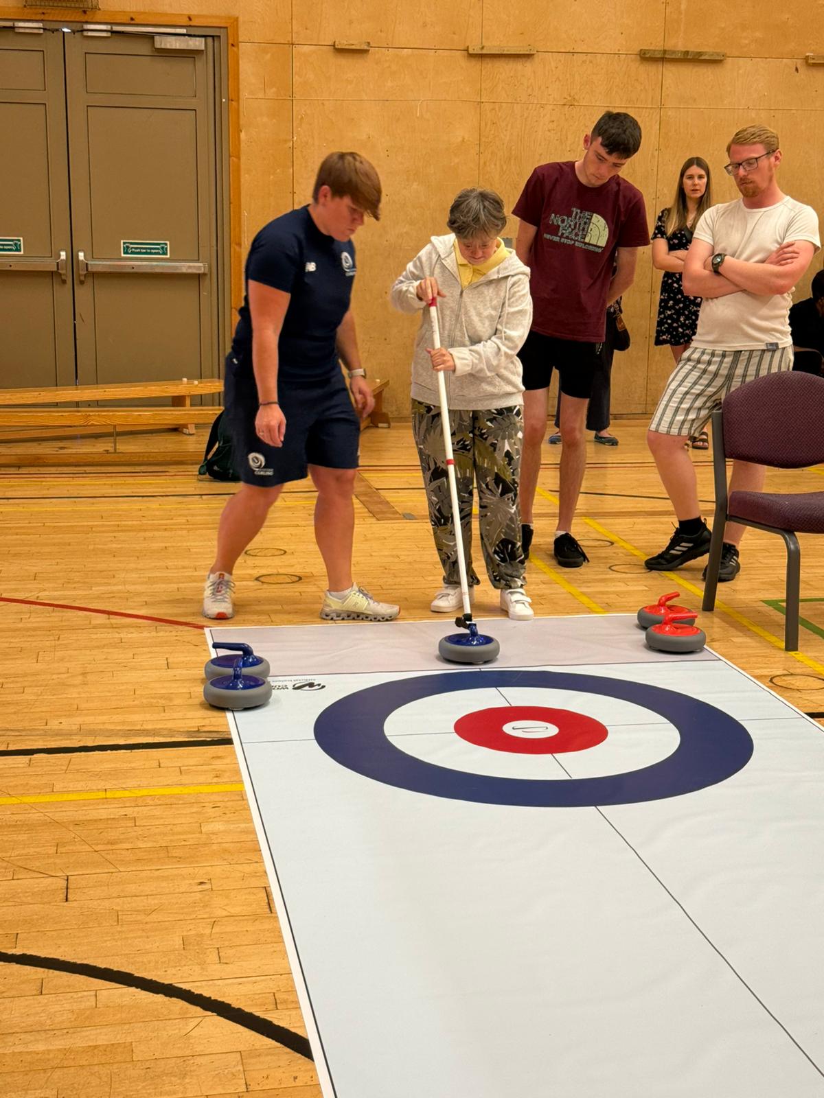members try indoor curling