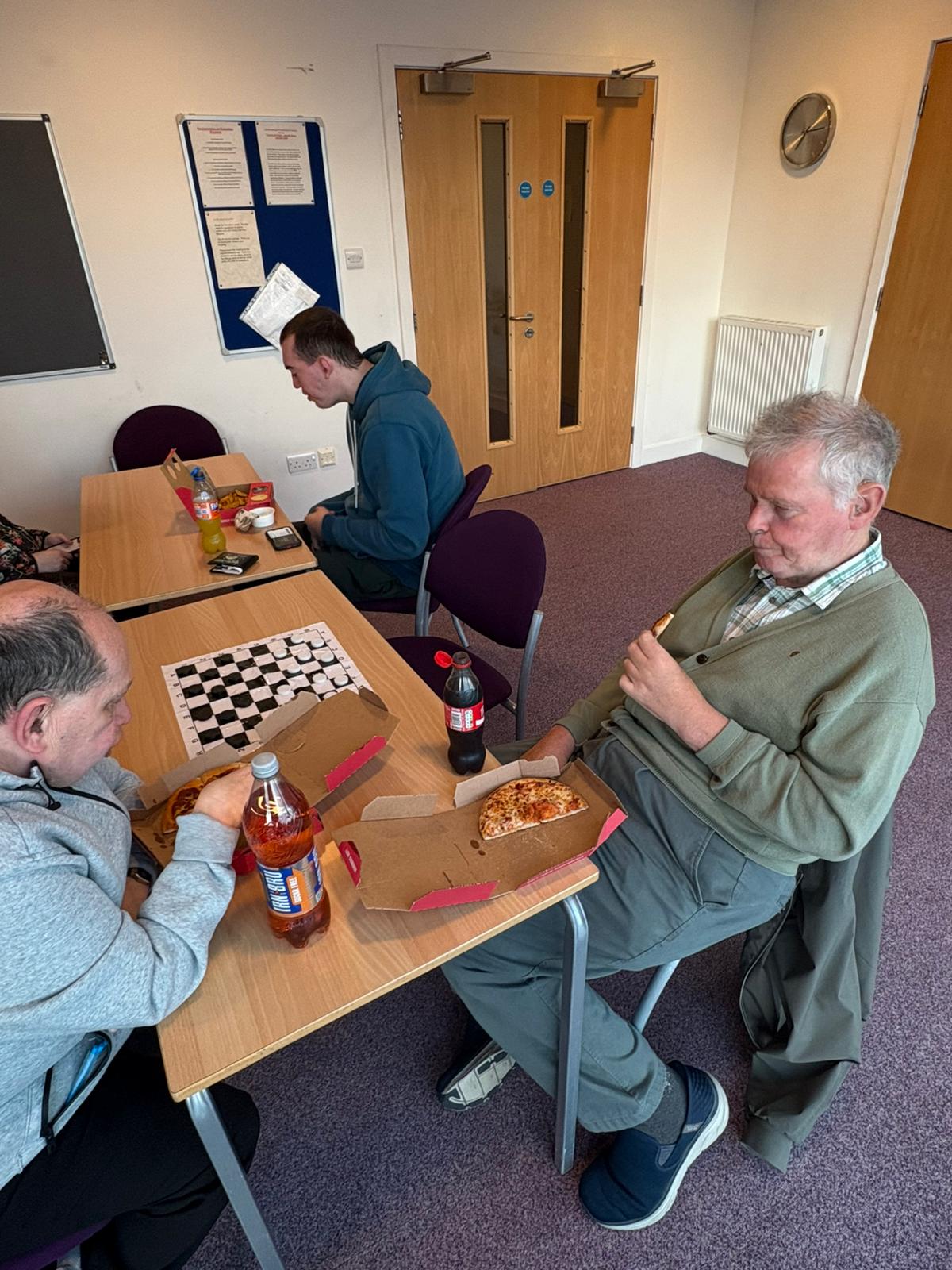 Members playing draughts