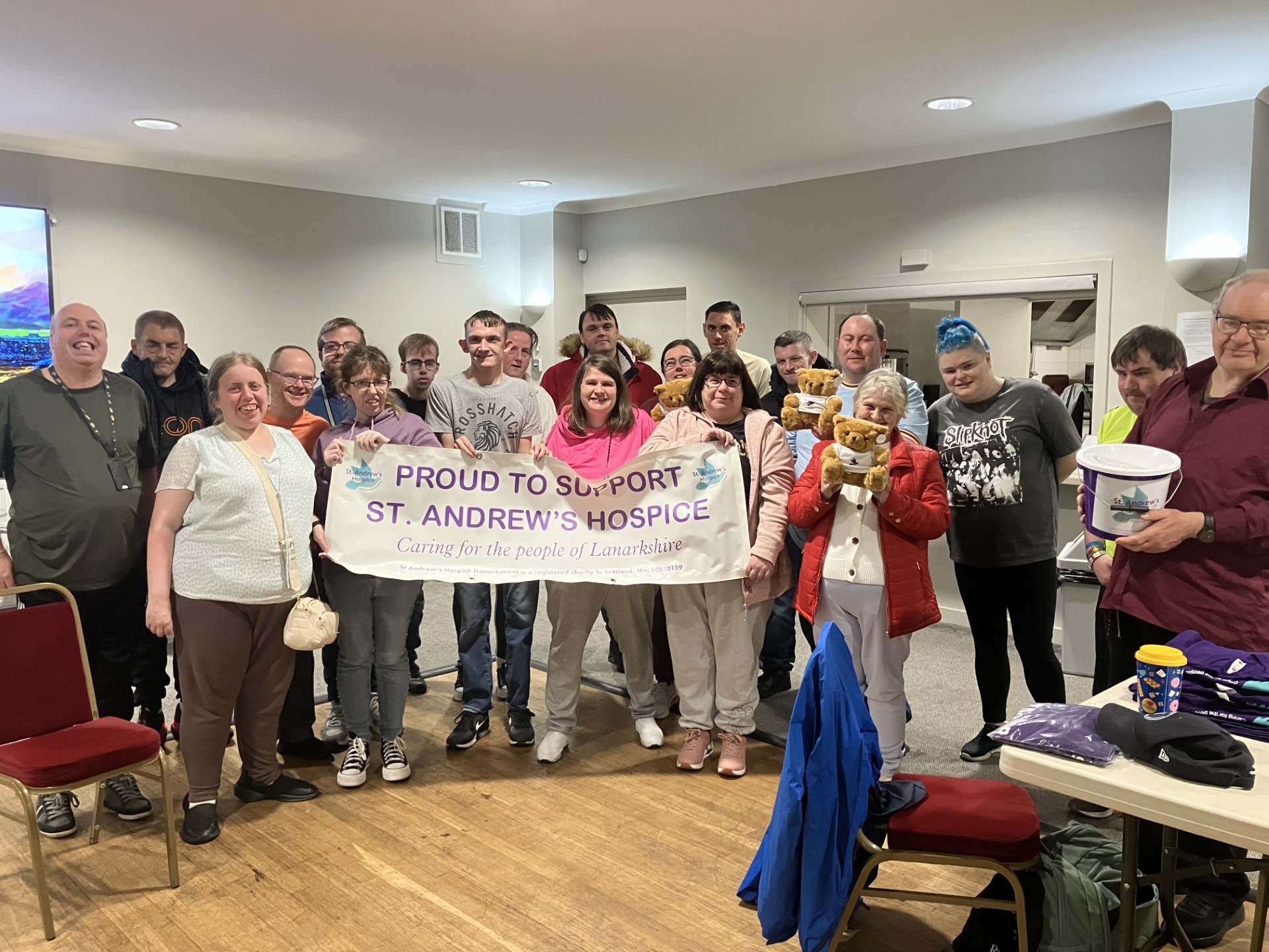 Members with Support St Andrews Hospice banner