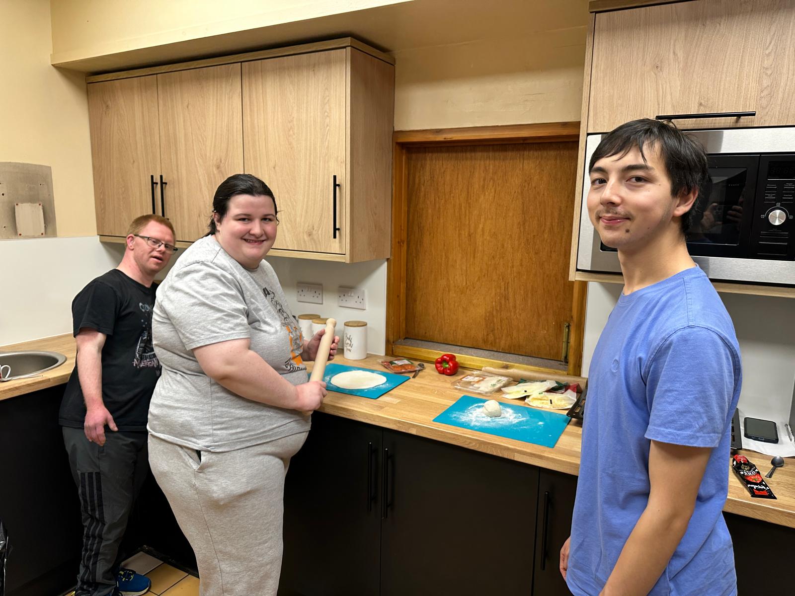 Members making pizza
